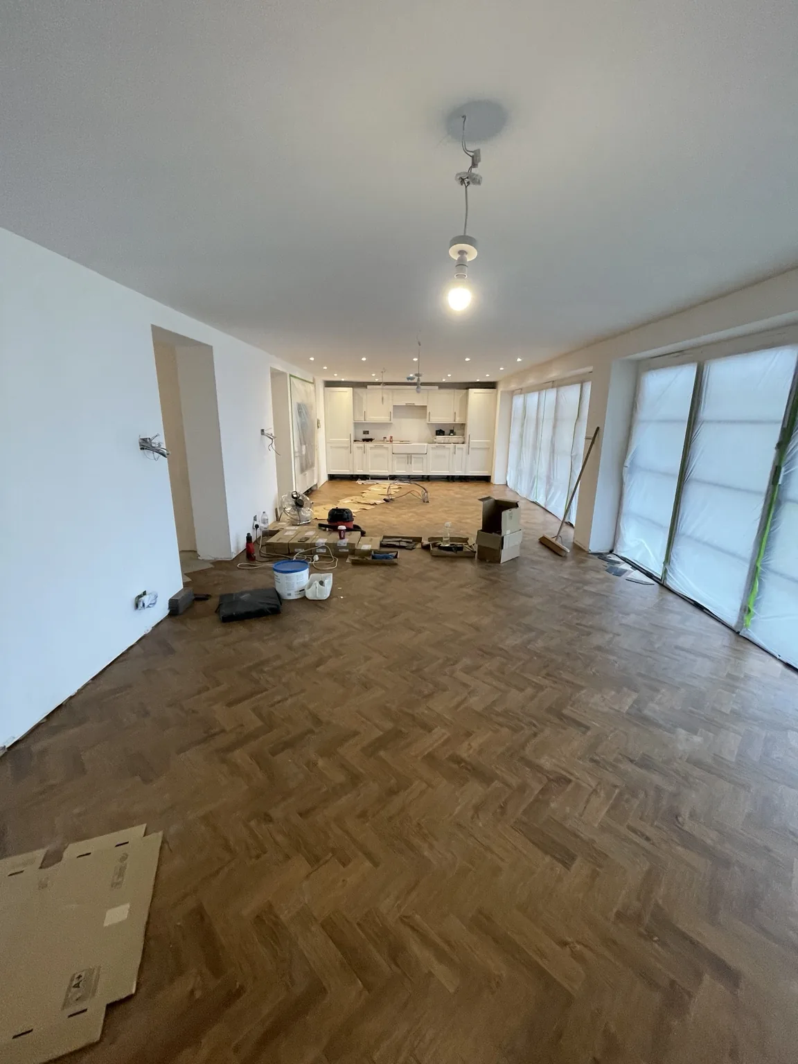 Open-plan kitchen and parquet flooring installation