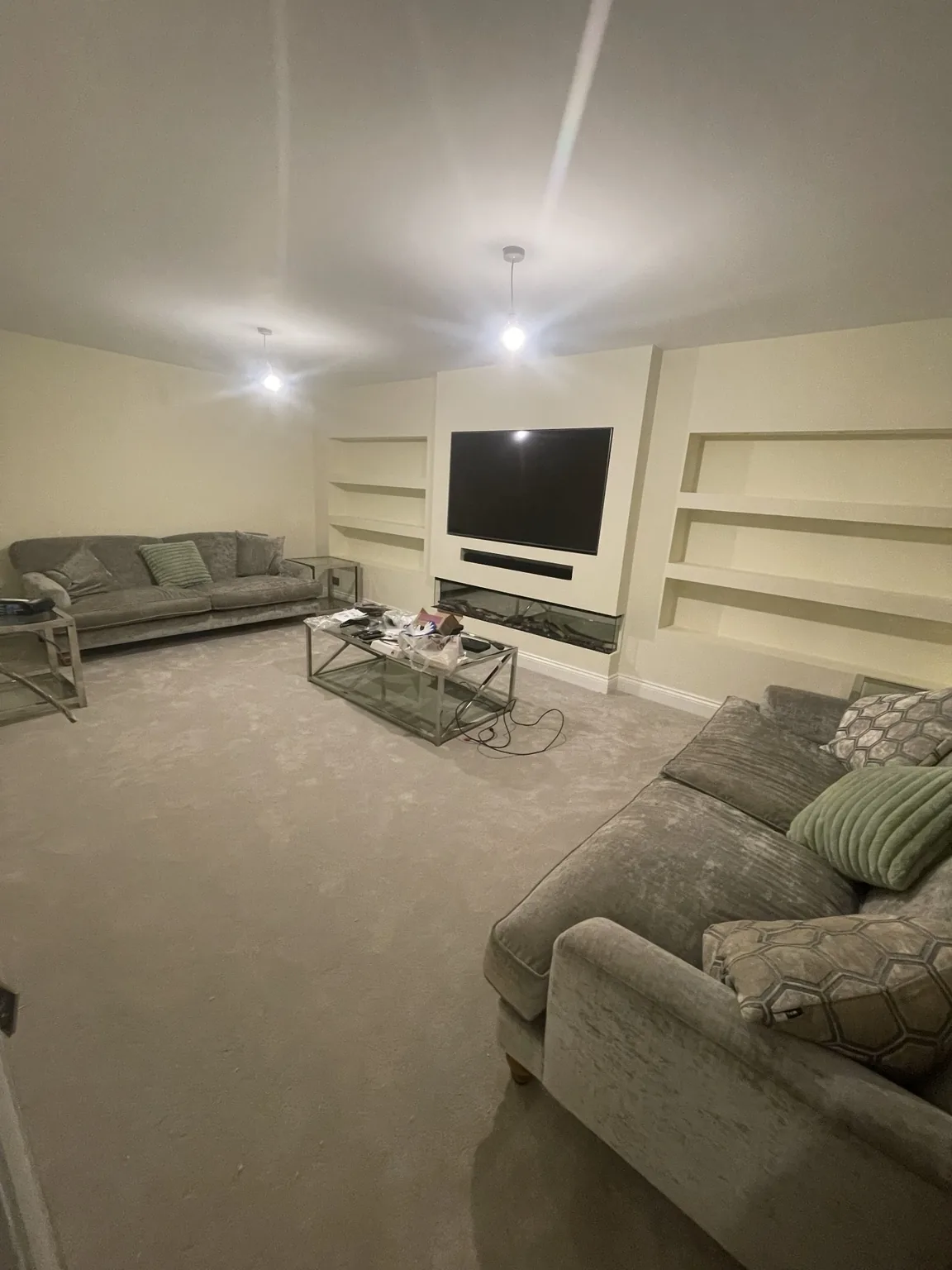 Completed lounge with media wall and fireplace
