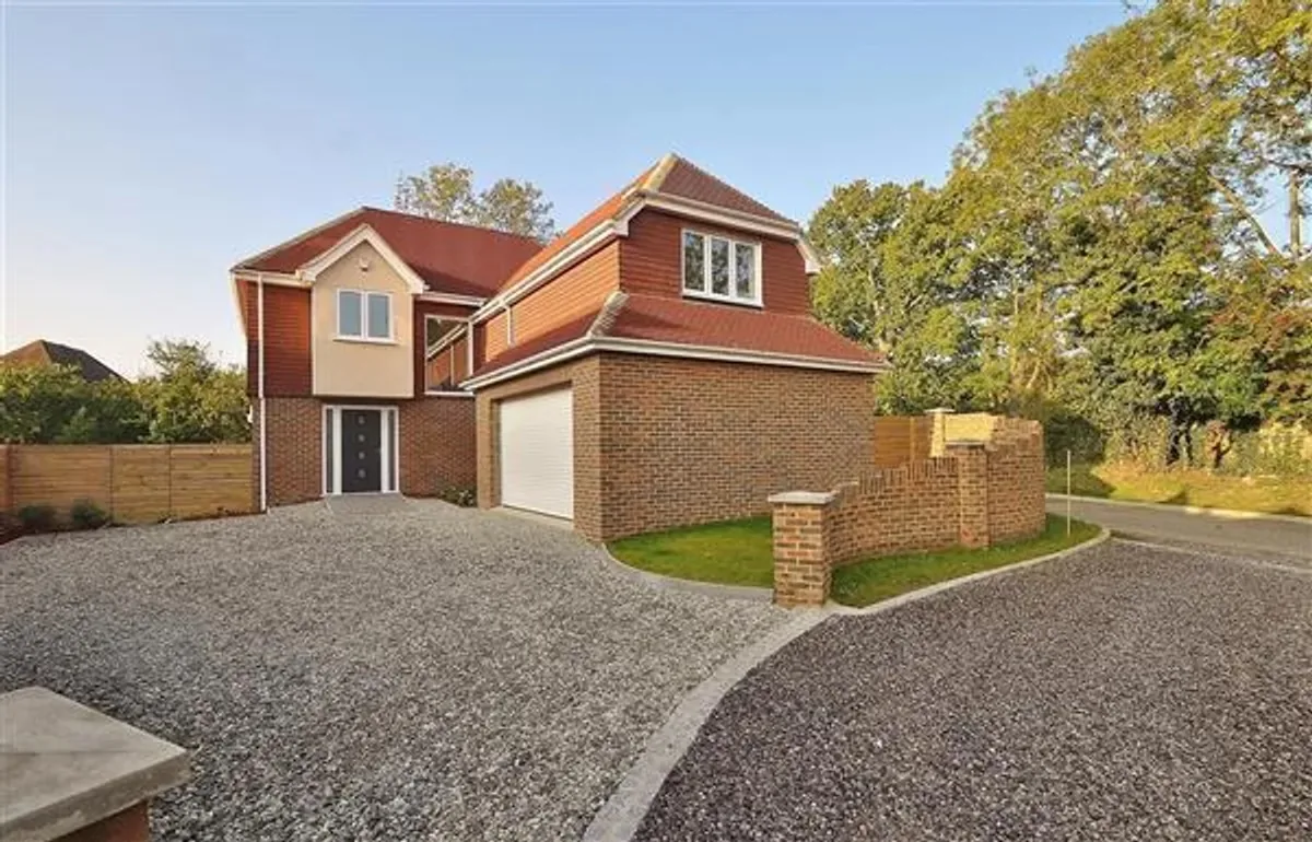 Completed residence front and garage elevation